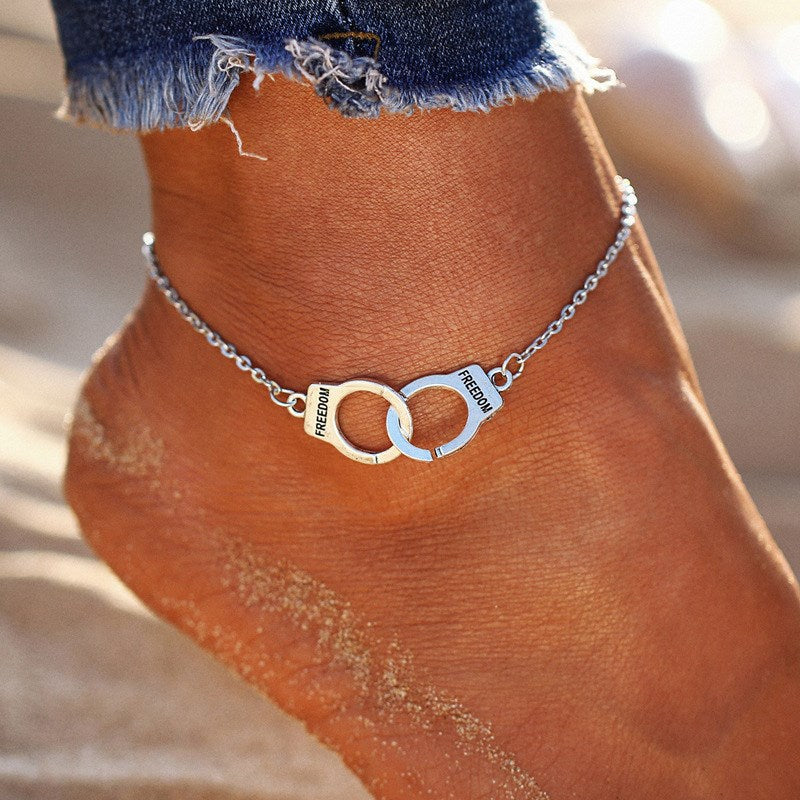 Ankle bracelet with a handcuff motif