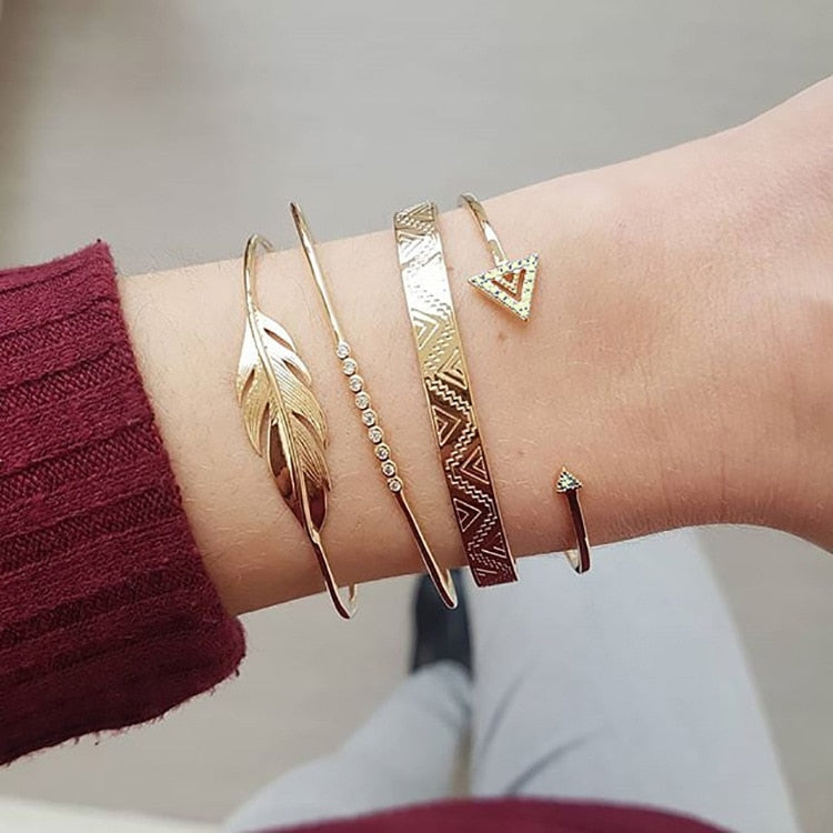 A set of bracelets with a feather