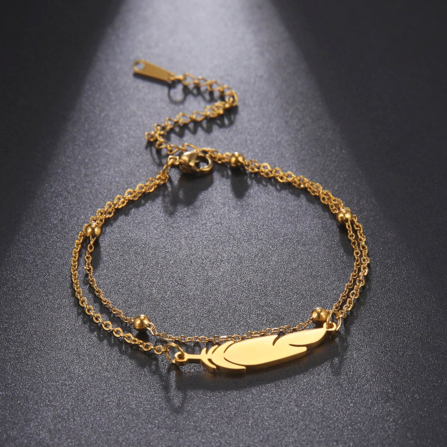 Ankle bracelet with a feather