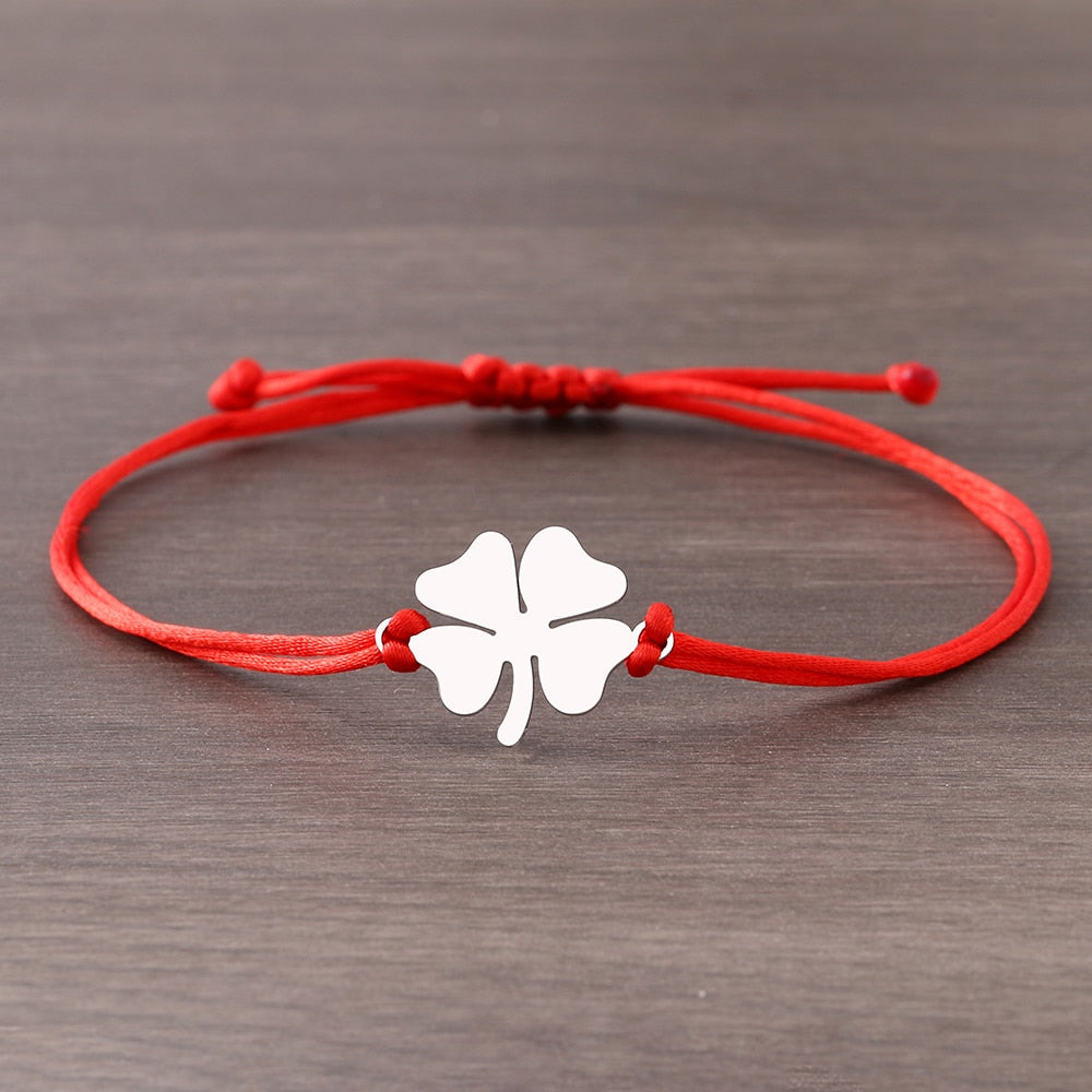 A bracelet on a thong with a four-leaf clover
