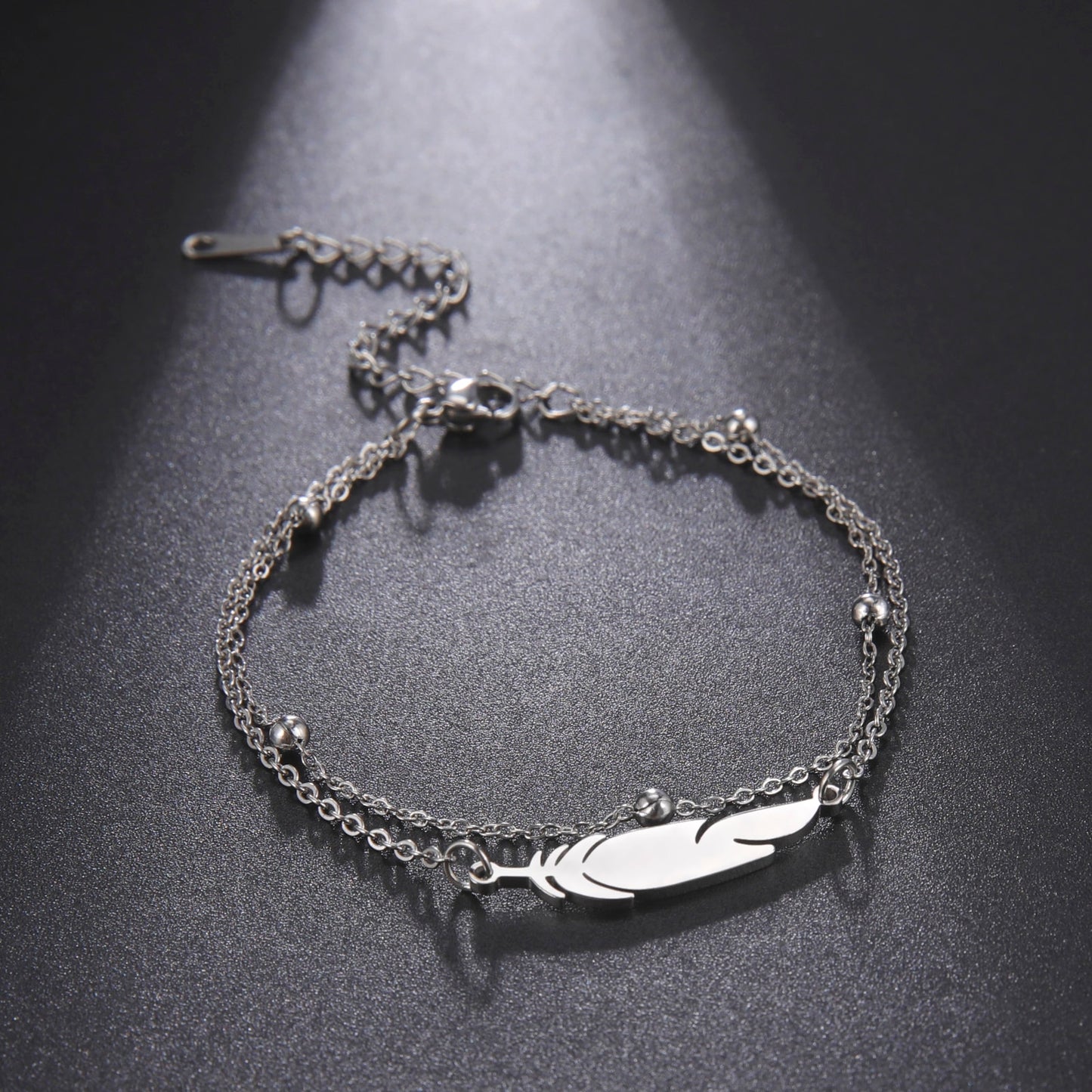 Ankle bracelet with a feather