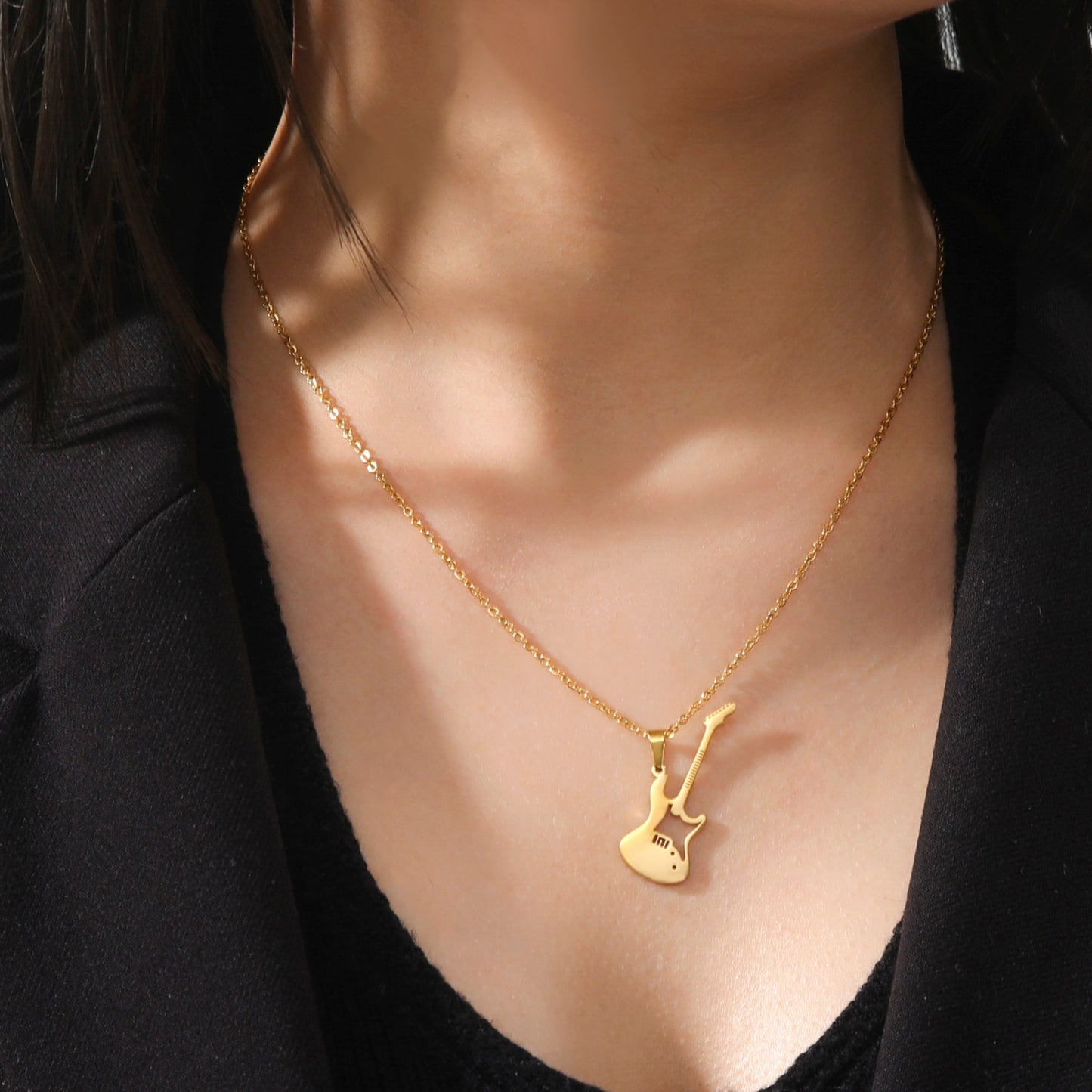 Necklace with guitar-shaped pendant
