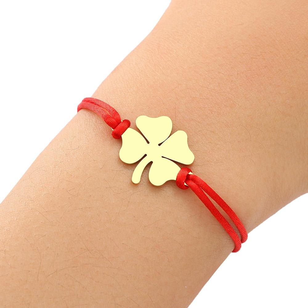 A bracelet on a thong with a four-leaf clover