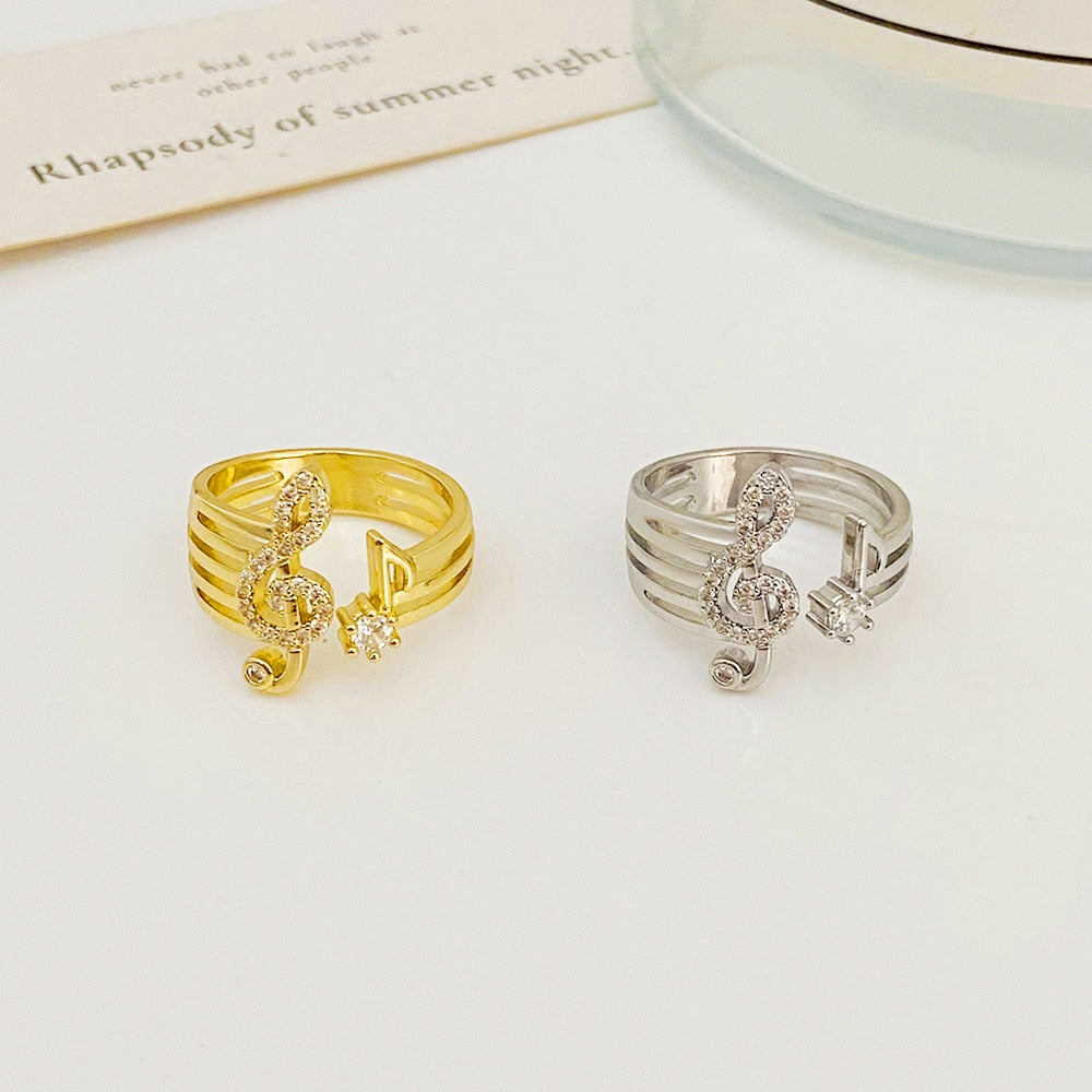 A shiny ring with a treble clef