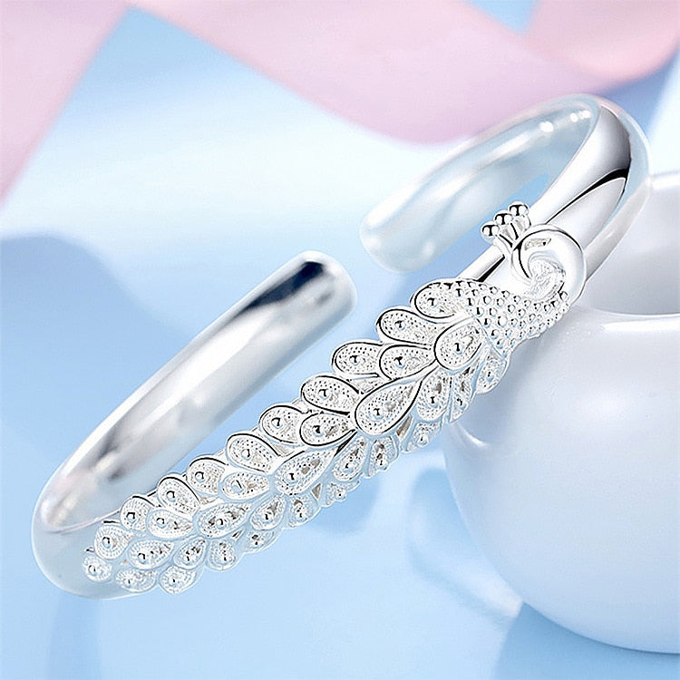 Silver bracelet with a peacock motif