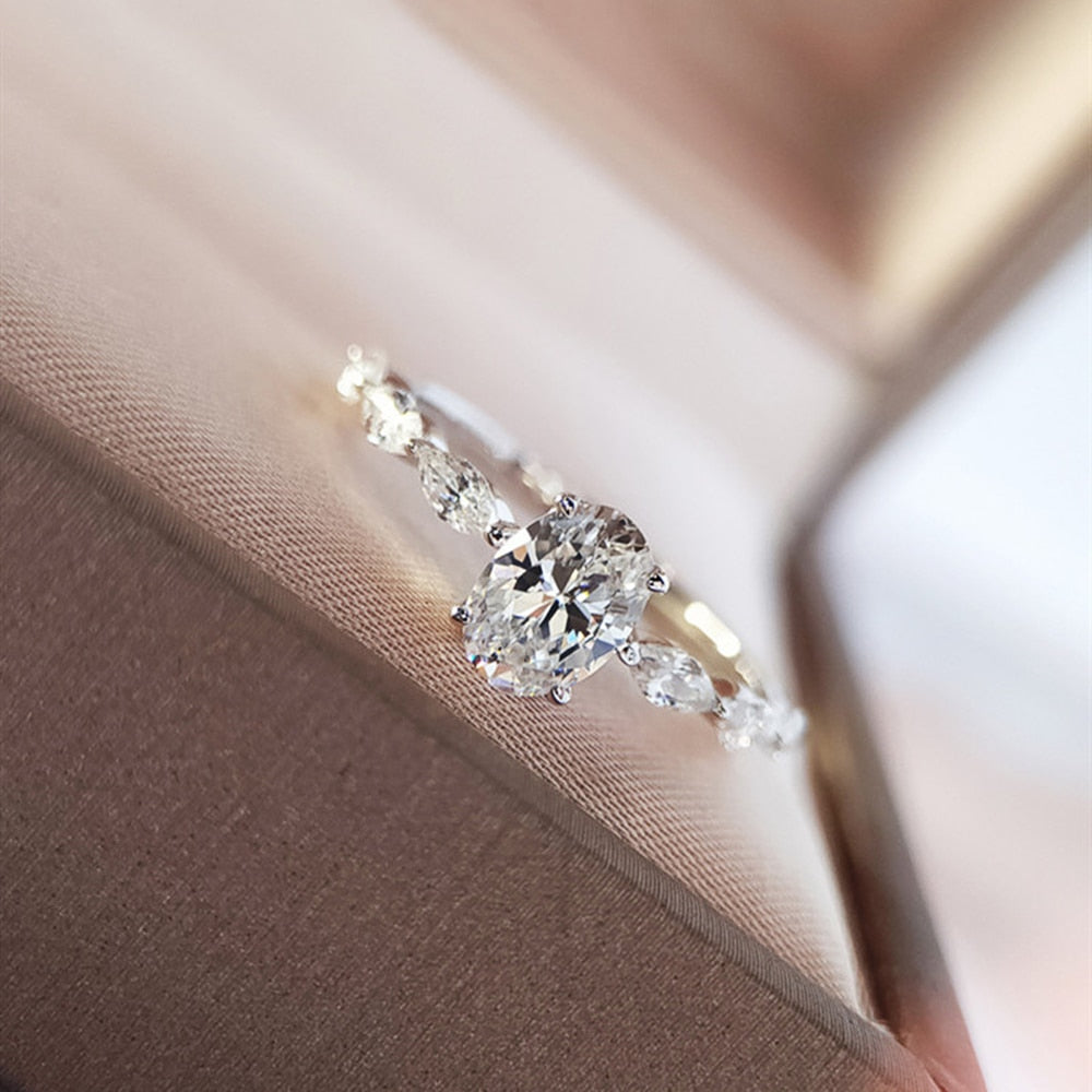 Ring with zircons and a large eyelet