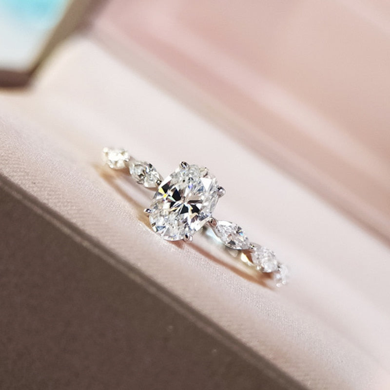 Ring with zircons and a large eyelet
