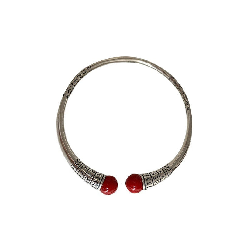 Silver bracelet with decorations