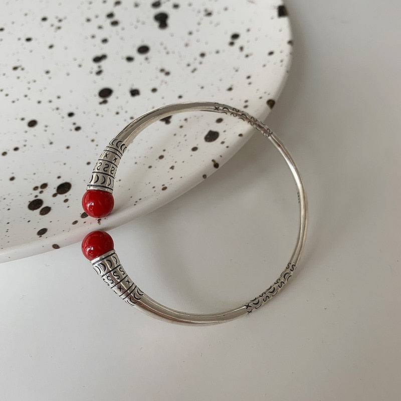 Silver bracelet with decorations