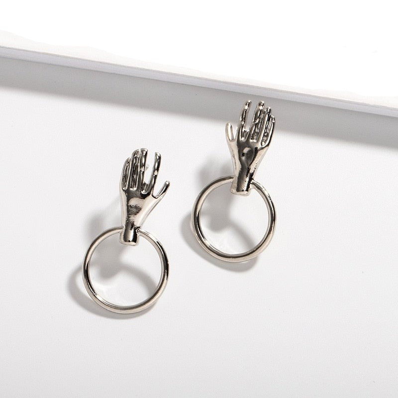 Earrings with a hand motif