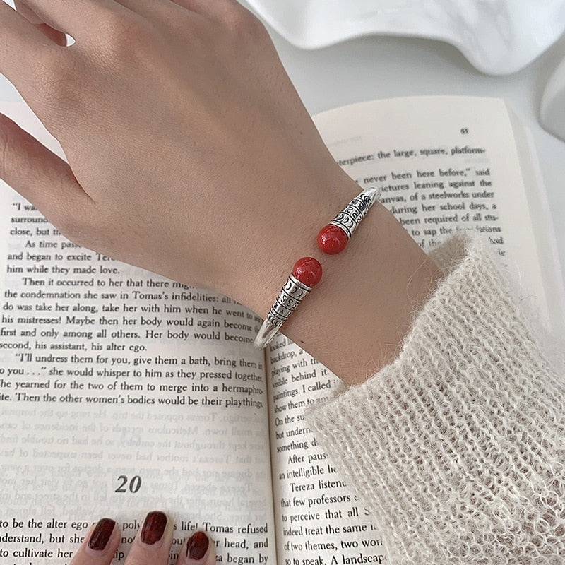 Silver bracelet with decorations