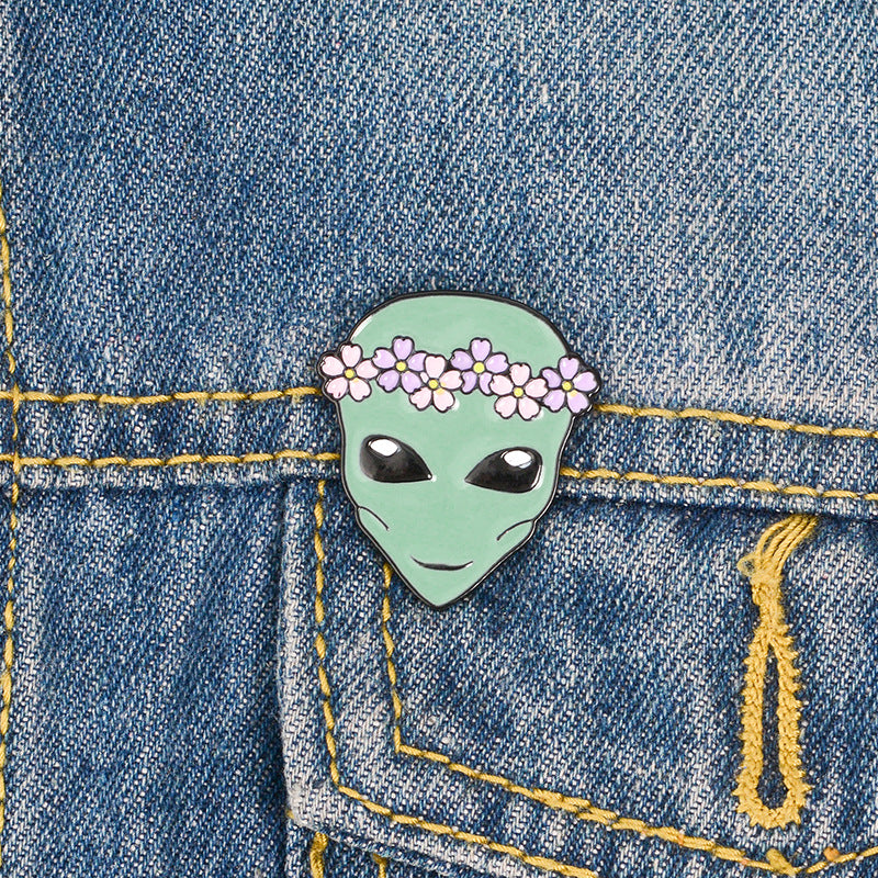 Alien pin with a wreath