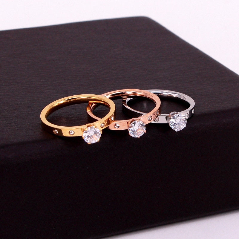 Ring with an eyelet and zircons