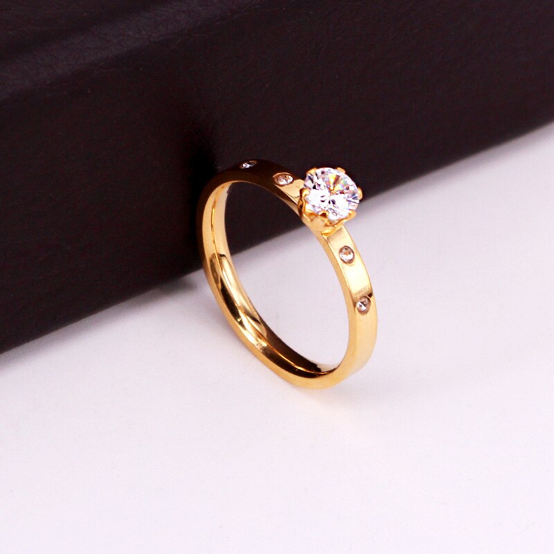 Ring with an eyelet and zircons