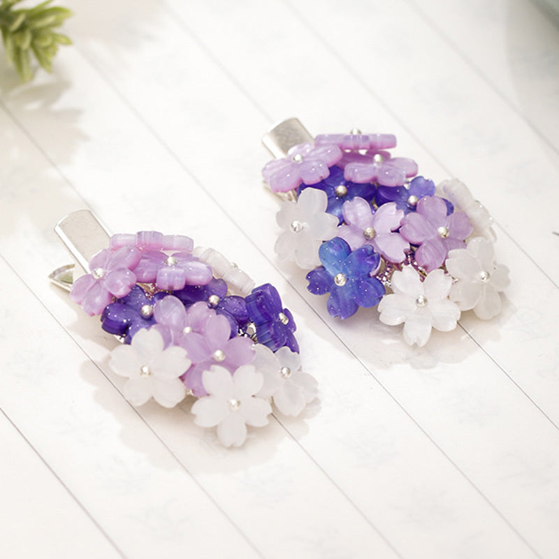 Hair clips with purple flowers