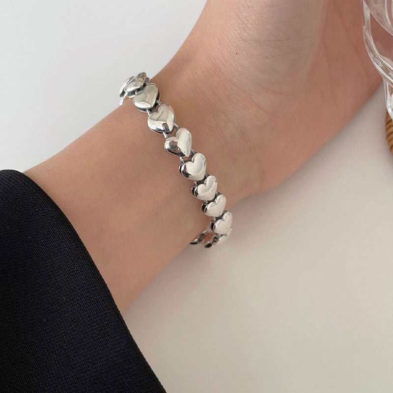 Silver heart motif bracelet