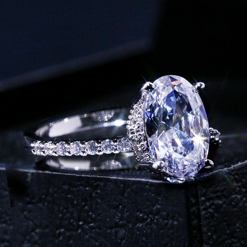 Ring with zircons and a large eyelet