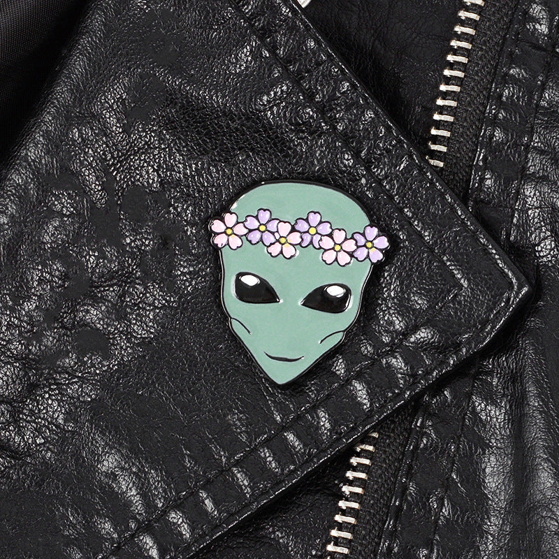 Alien pin with a wreath