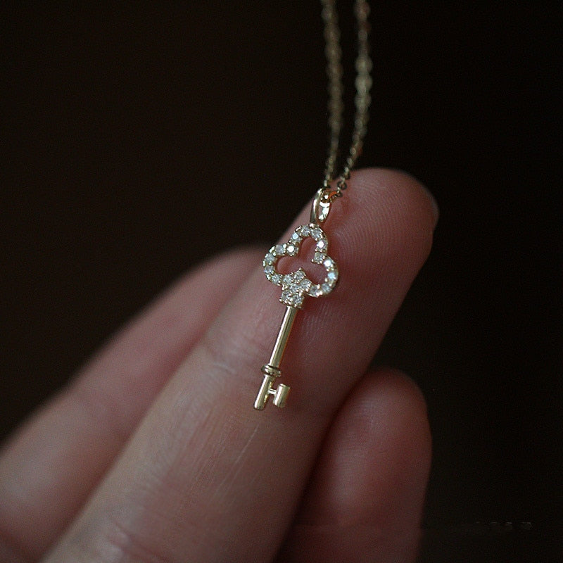 Silver necklace with a pendant - a key