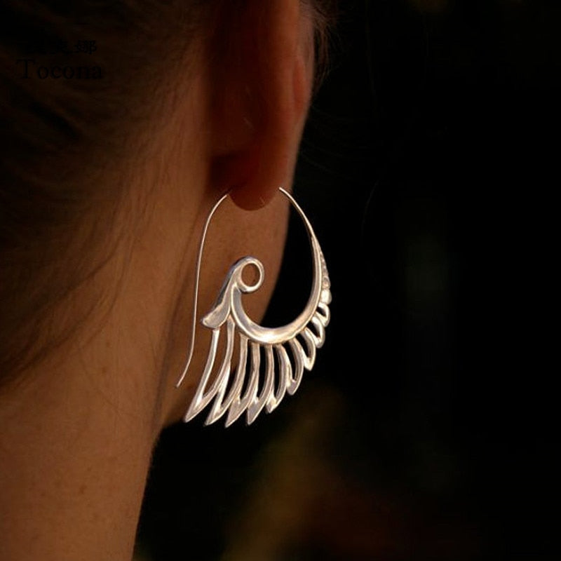 Wing motif earrings