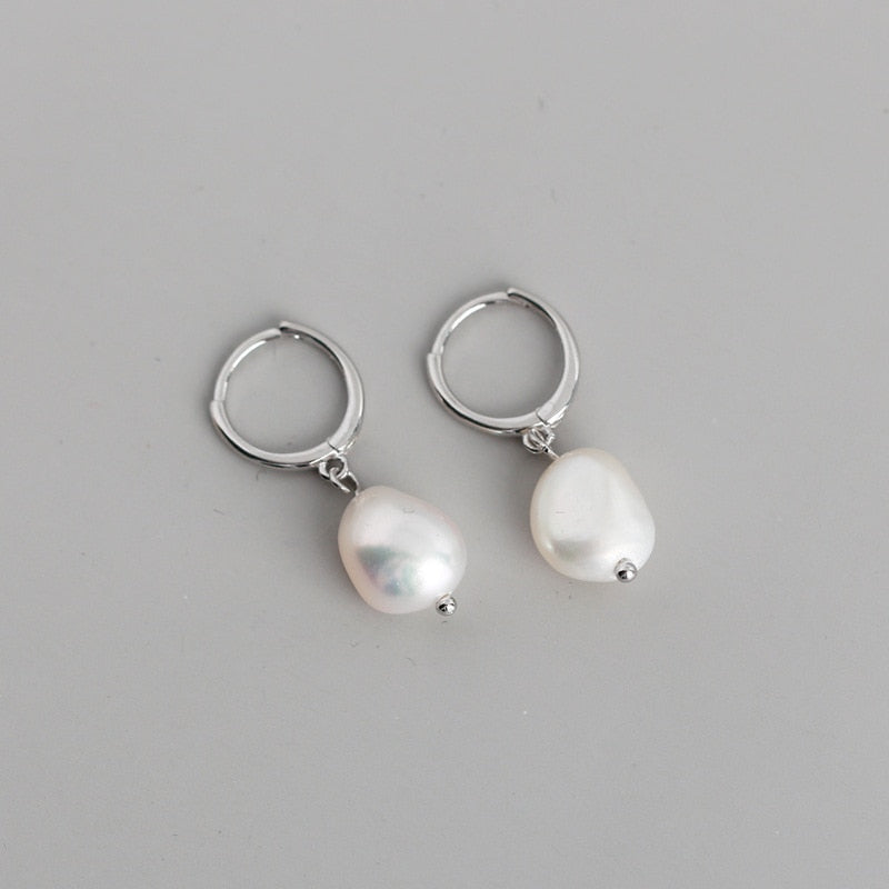 Earrings with pearl pendants
