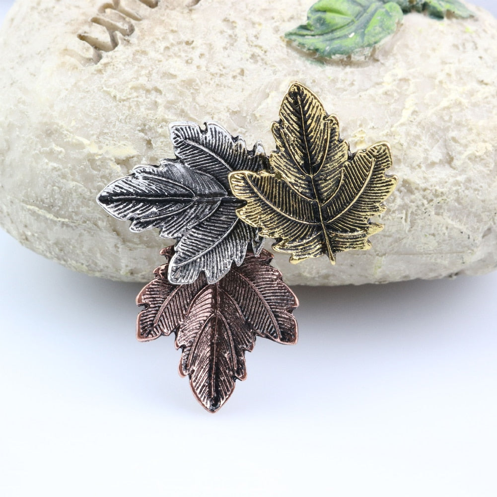Pin with a leaf motif