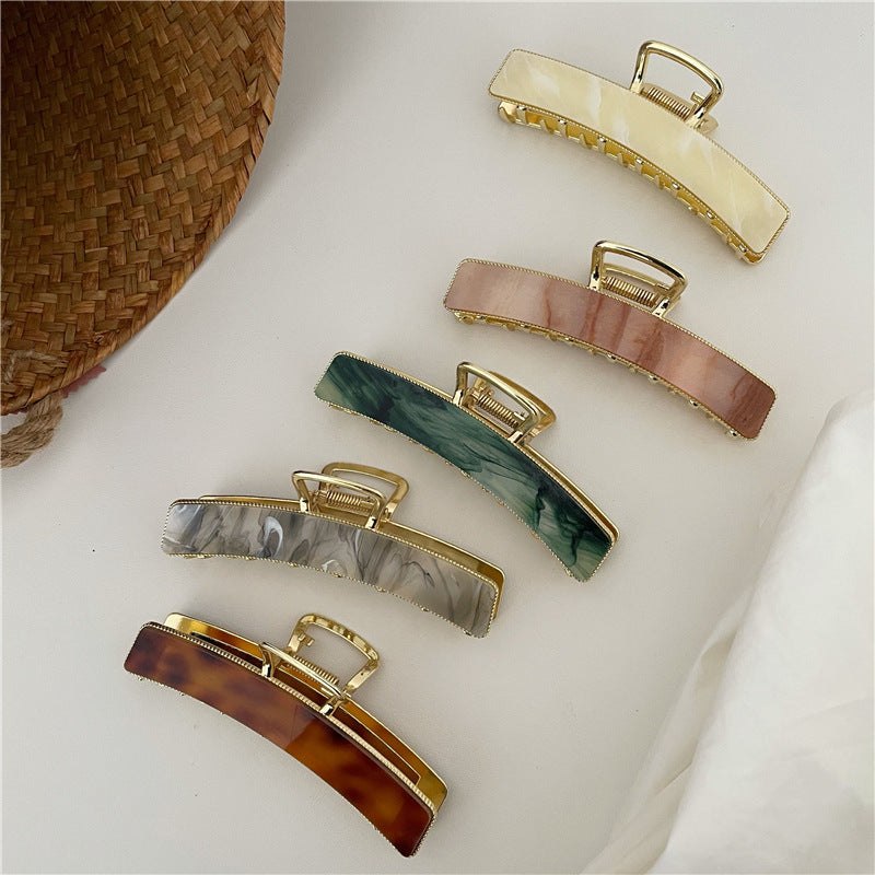 Acrylic hair clip with a marble pattern