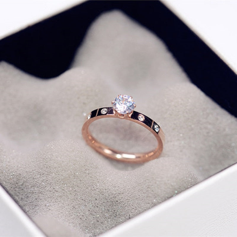 Ring with an eyelet and zircons