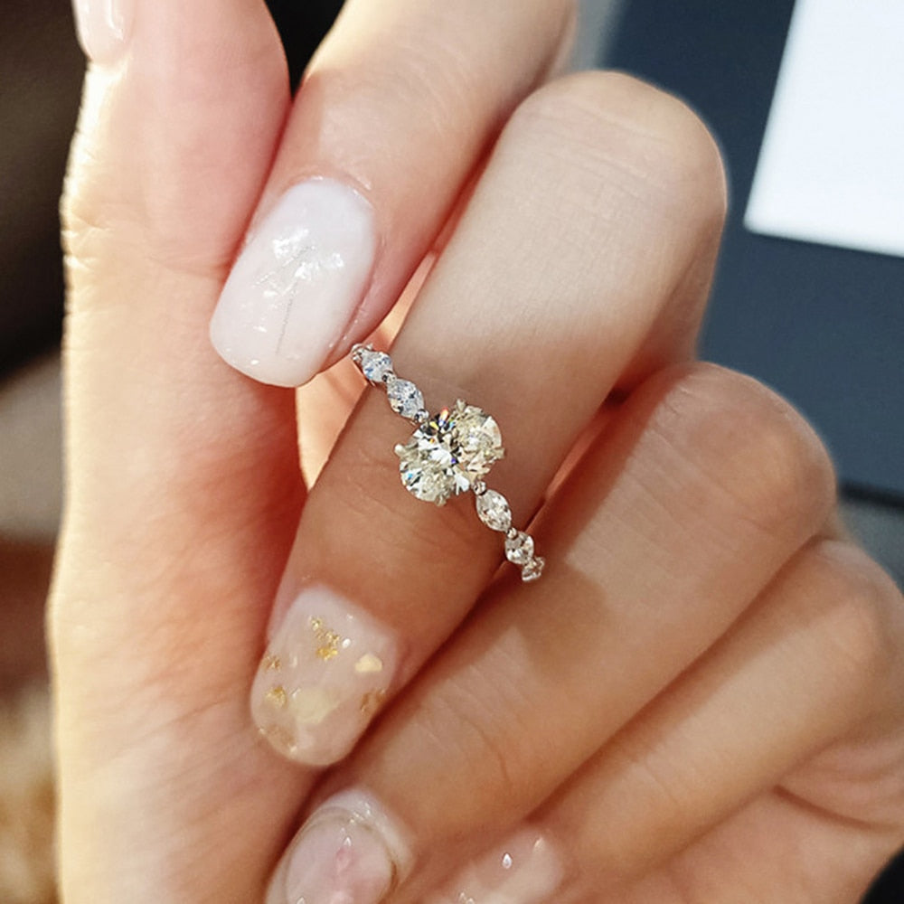 Ring with zircons and a large eyelet