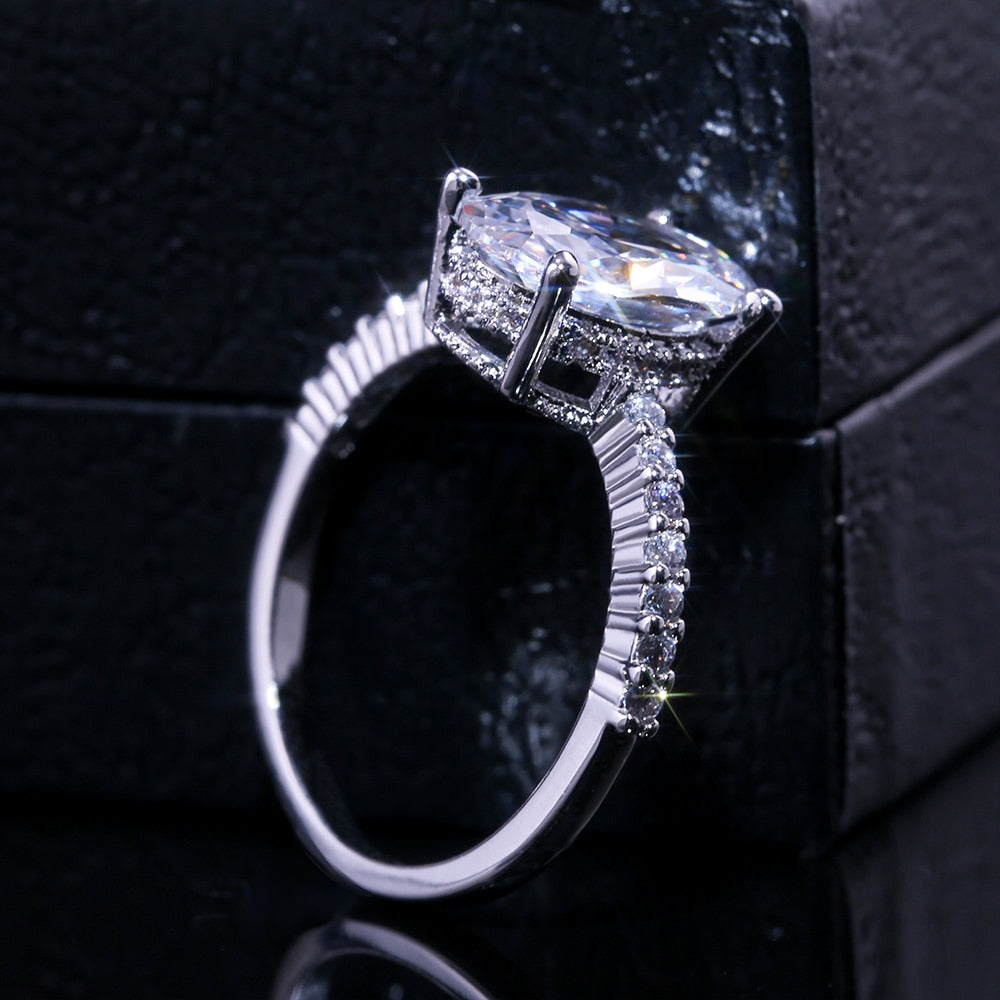 Ring with zircons and a large eyelet