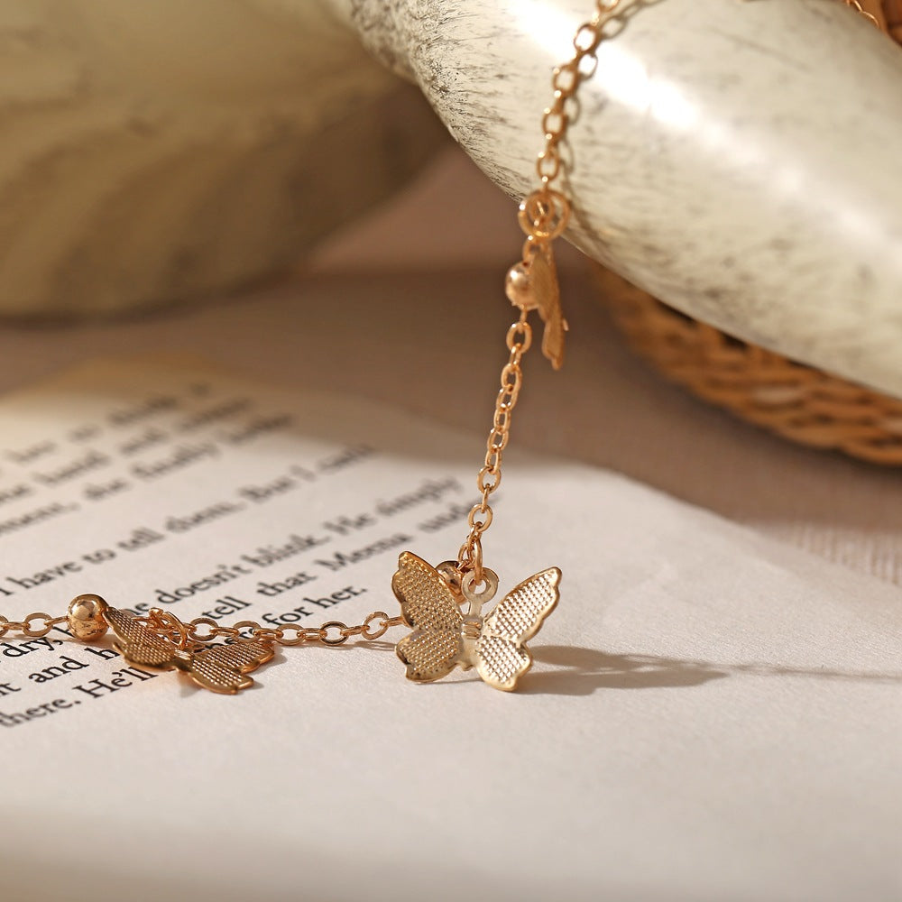 Ankle bracelet with butterfly pendants