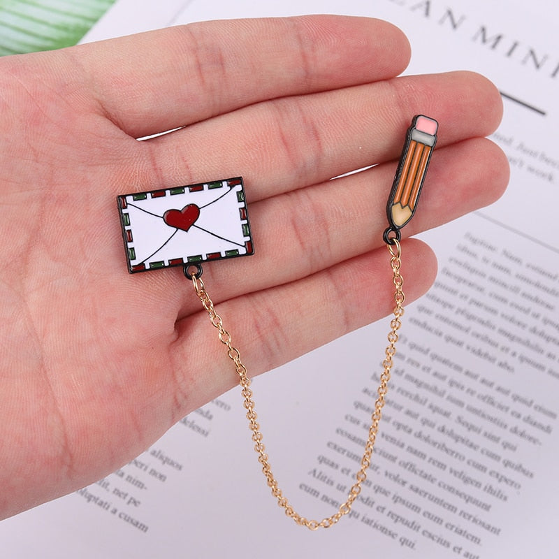 Pin with a chain - letter