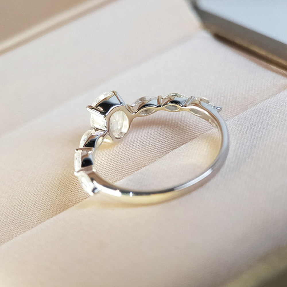 Ring with zircons and a large eyelet