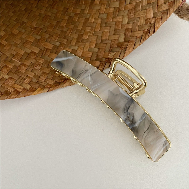 Acrylic hair clip with a marble pattern