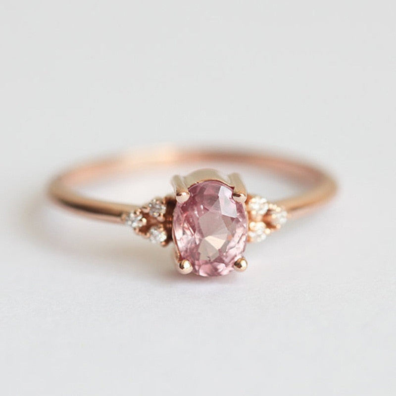 Ring with zircons and a large eyelet