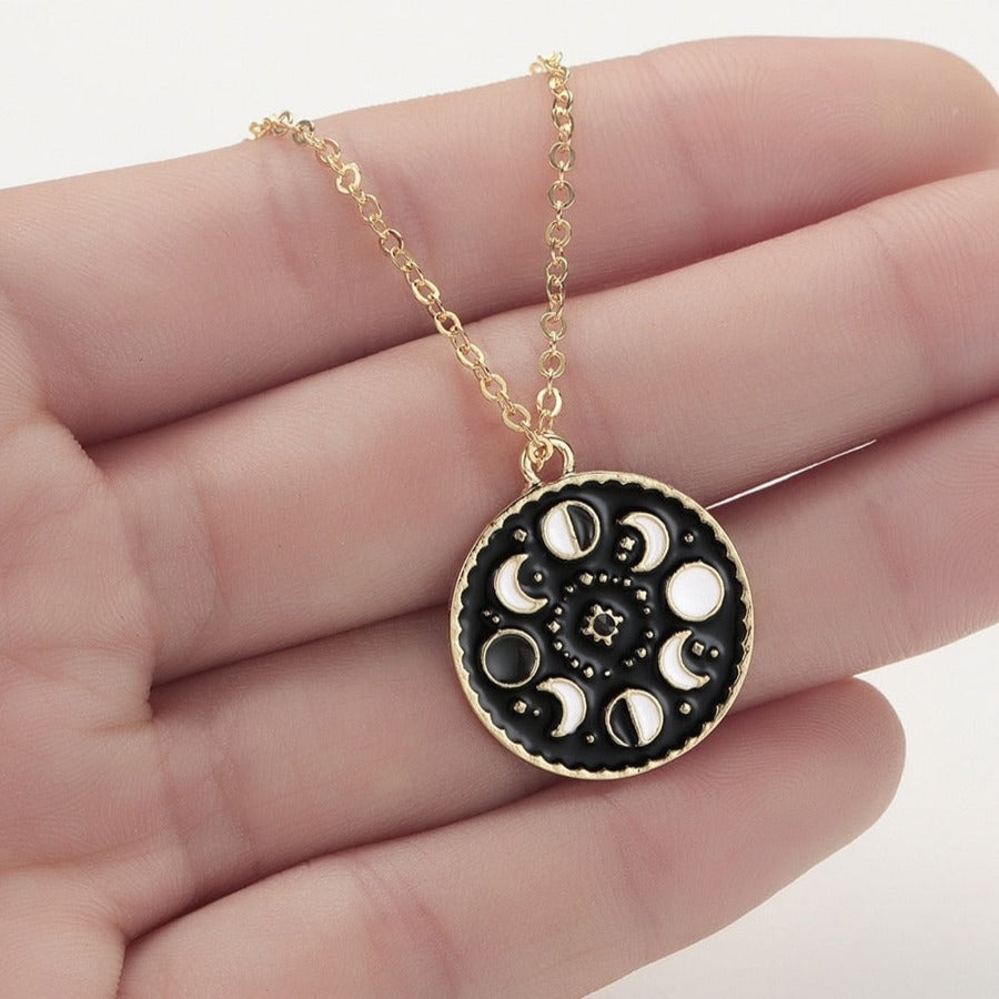 Necklace with a pendant in the shape of moon phases