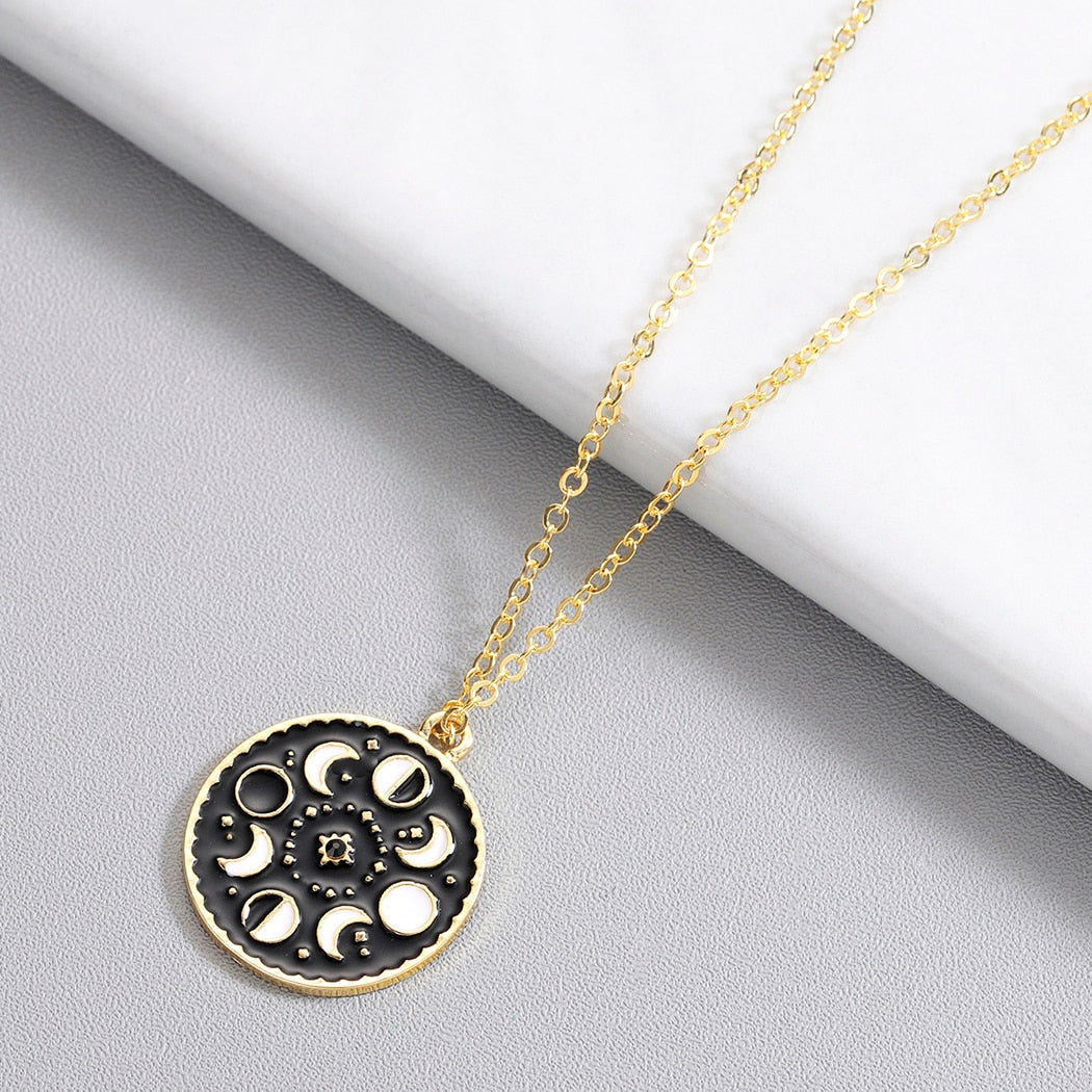 Necklace with a pendant in the shape of moon phases