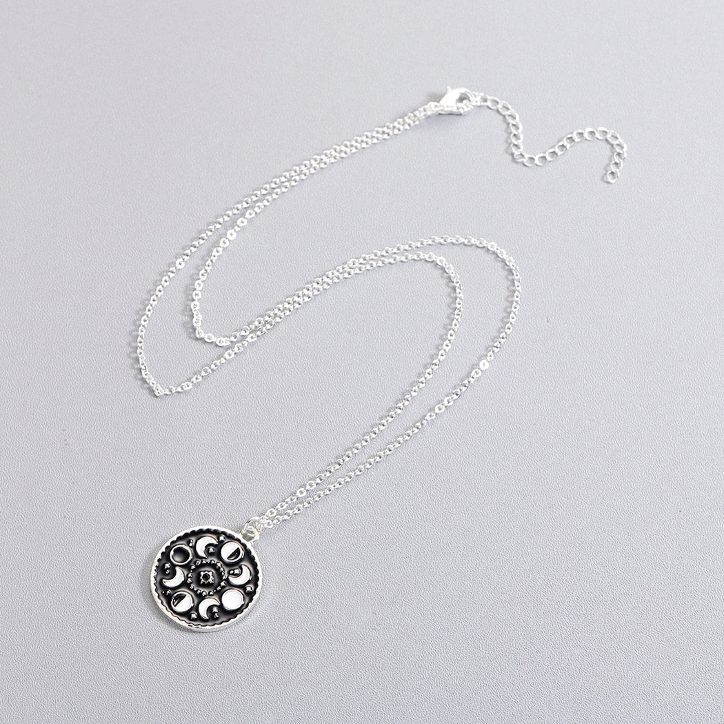 Necklace with a pendant in the shape of moon phases