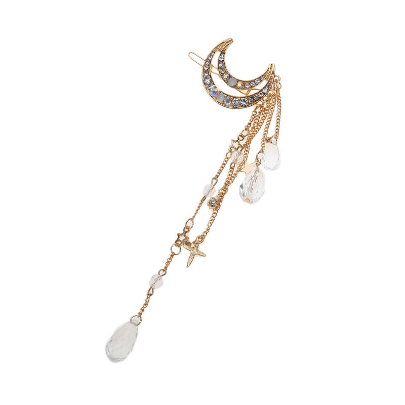 Moon-shaped hair clip with hanging beads