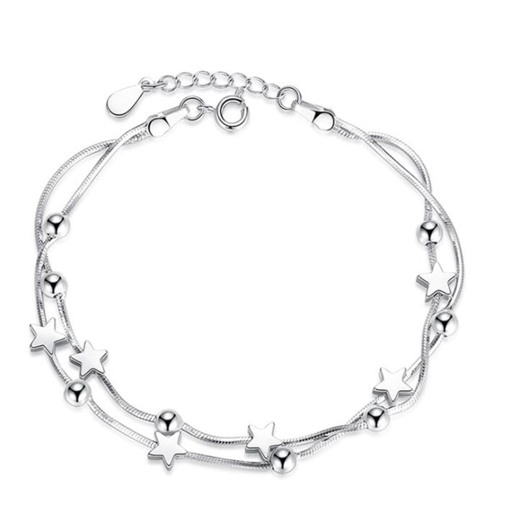 Silver bracelet with decorative pendants