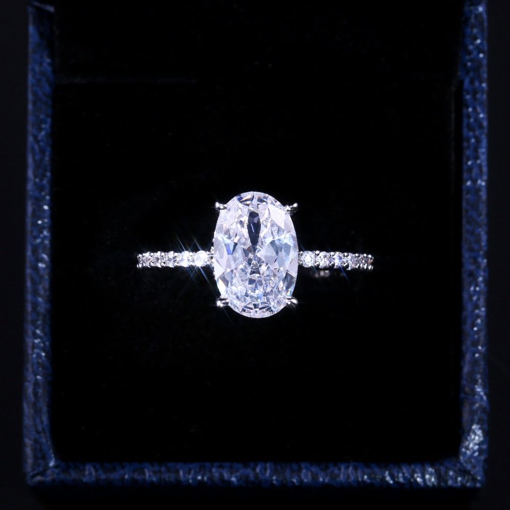 Ring with zircons and a large eyelet
