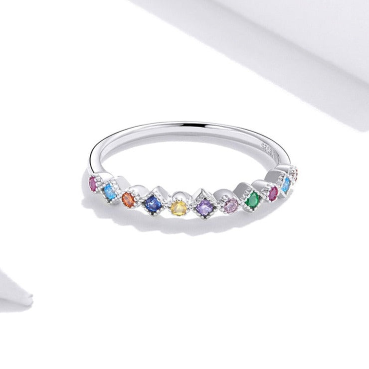 Ring with colorful zircons
