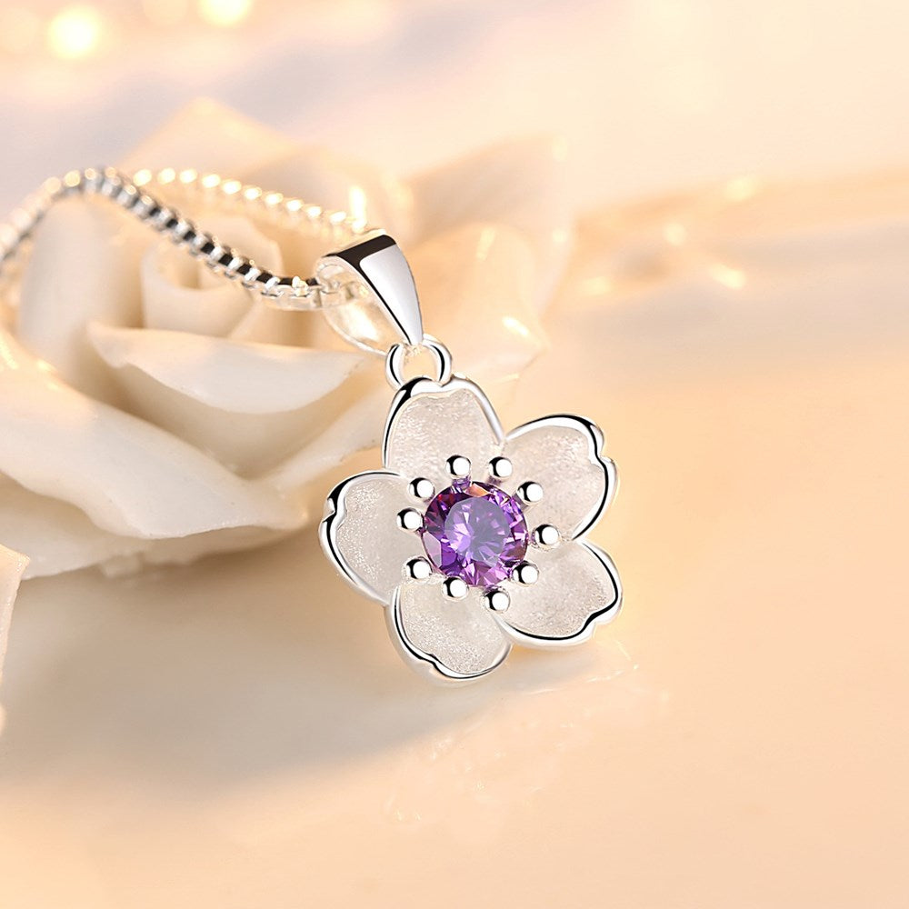 Silver necklace with a flower pendant