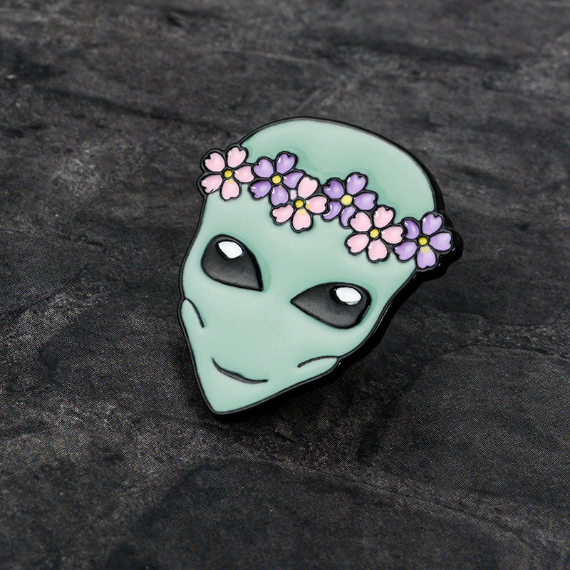 Alien pin with a wreath