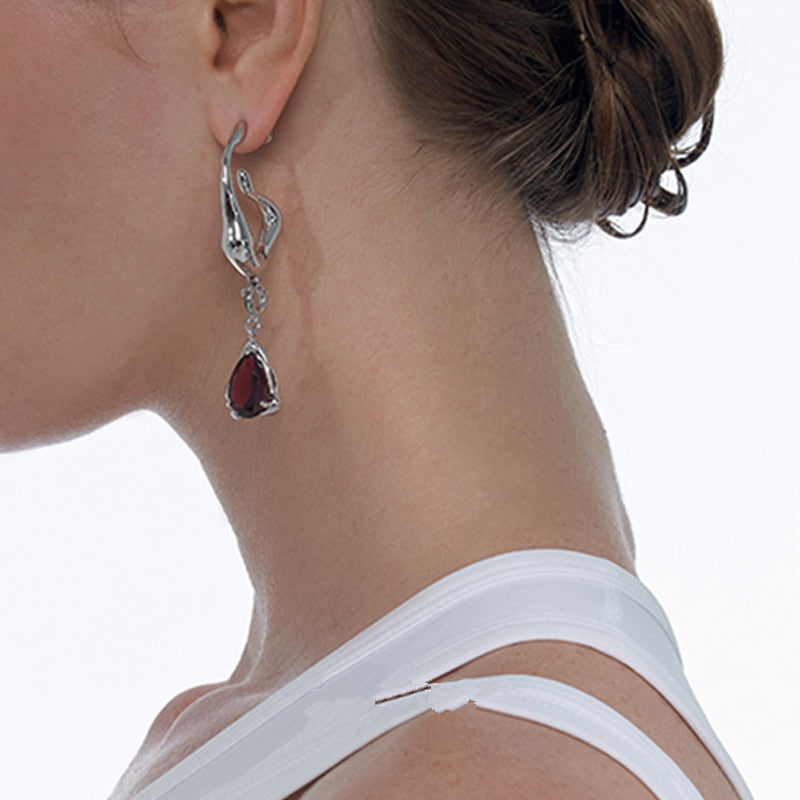 Hanging earrings with a stone