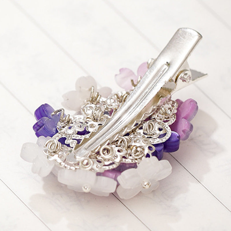 Hair clips with purple flowers