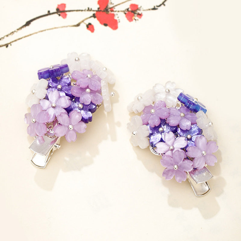 Hair clips with purple flowers
