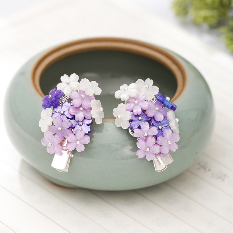 Hair clips with purple flowers
