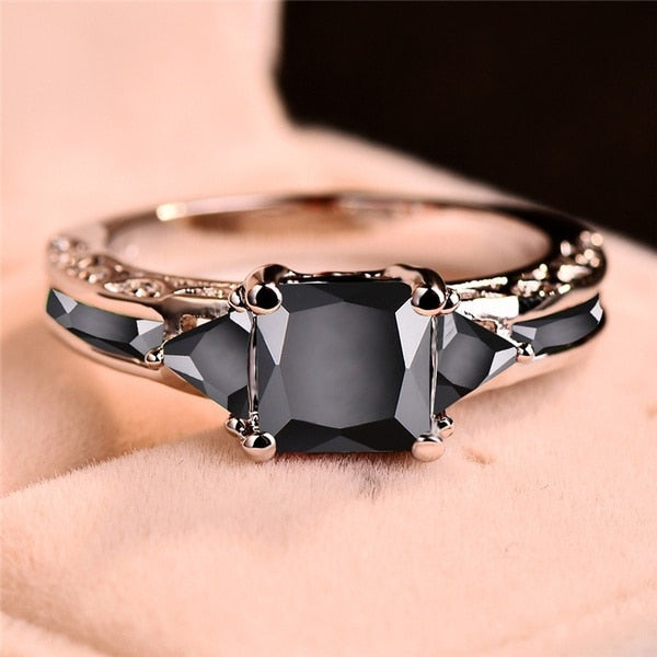 Ring with black zircons