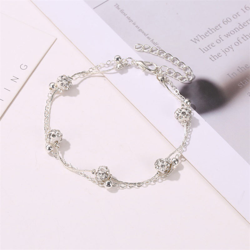 Double ankle bracelet with accessories